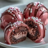 A close-up shows Oreo Truffle Balls with Pink Candy Coating, studded with tiny edible pearls and rainbow sprinkles for a festive dessert spread.  