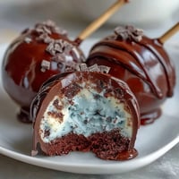 Delightful robins egg blue cake pops with speckled chocolate coating, perfect for Easter dessert tables.